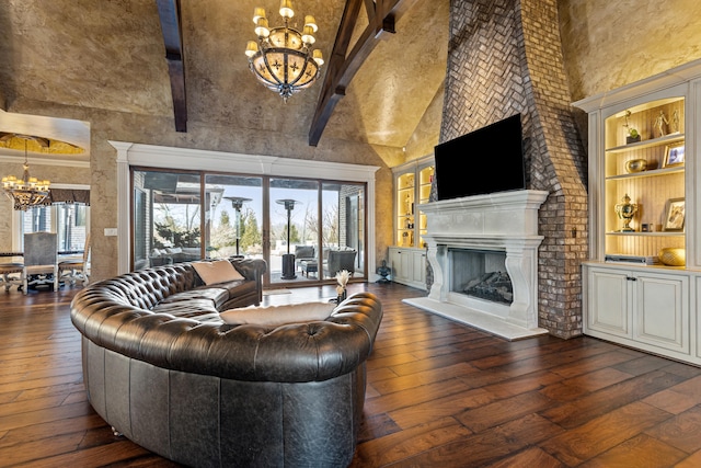 living room featuring a chandelier, high vaulted ceiling, dark wood-style floors, beamed ceiling, and built in shelves