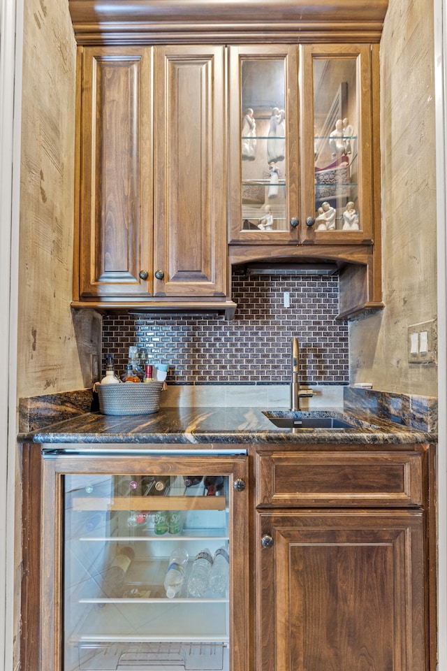 indoor bar featuring tasteful backsplash and beverage cooler