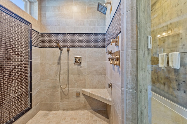 full bathroom featuring tiled shower