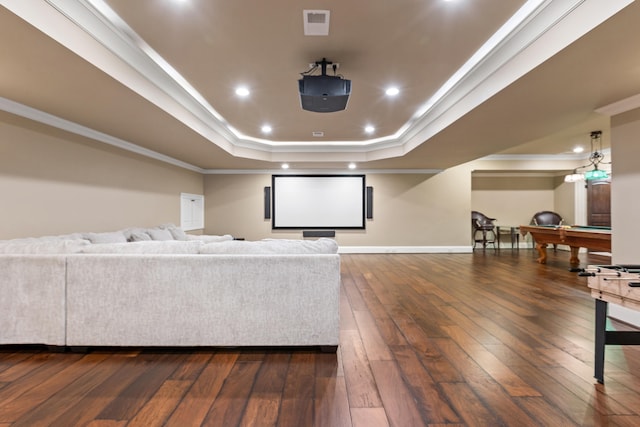 cinema featuring a raised ceiling, hardwood / wood-style floors, baseboards, ornamental molding, and billiards table