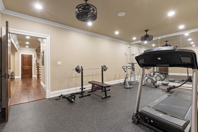 workout area featuring ornamental molding, baseboards, and recessed lighting