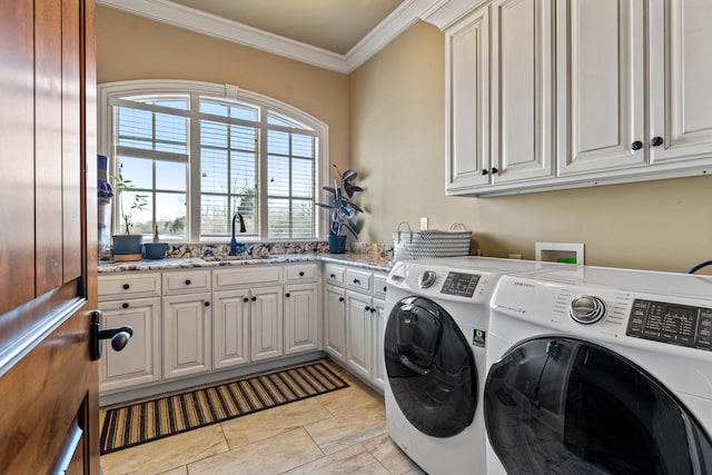 washroom featuring cabinet space, washer and clothes dryer, ornamental molding, and light tile patterned flooring
