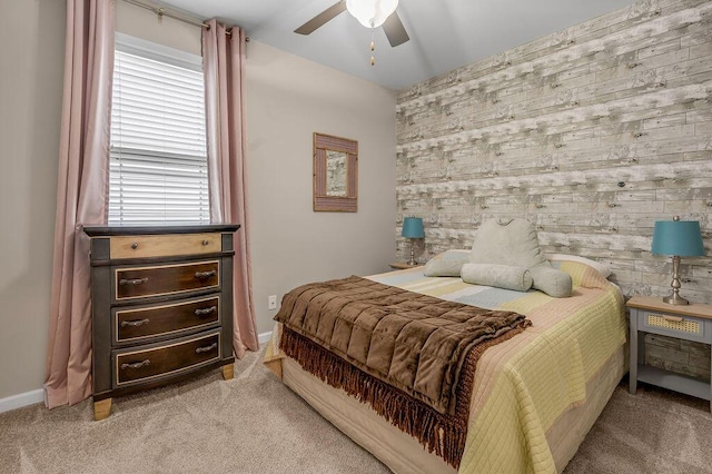 bedroom with light carpet, baseboards, and ceiling fan