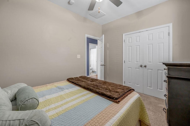 bedroom featuring light carpet, a closet, and ceiling fan