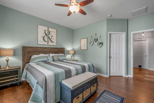 bedroom featuring dark wood-style flooring, baseboards, and a ceiling fan