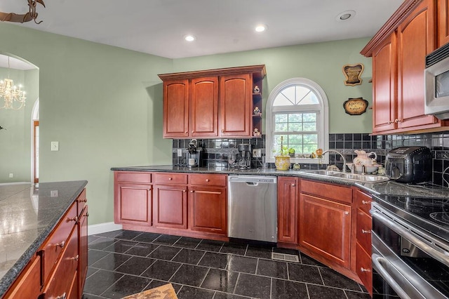 1100 Lloyd Rd, Georgetown, KY 40324 - kitchen with appliances with stainless steel finishes, a sink, dark countertops, decorative backsplash, and recessed lighting