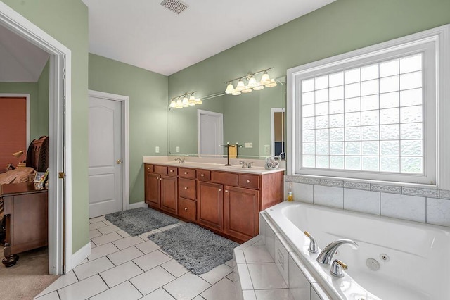 full bath featuring a whirlpool tub, double vanity, and tile patterned flooring