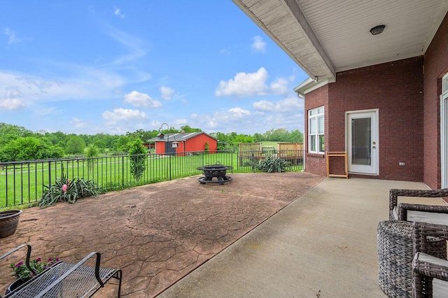 view of patio / terrace featuring an outdoor fire pit and a fenced backyard