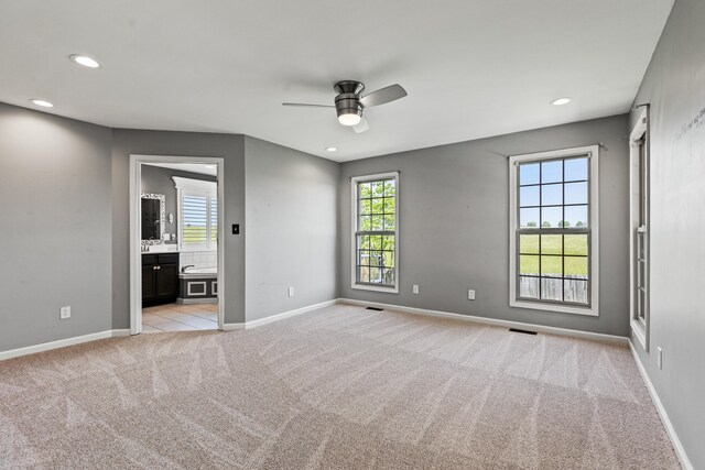unfurnished room featuring light carpet, baseboards, ceiling fan, and recessed lighting
