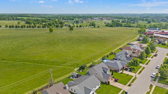 aerial view of residential area with a tree filled landscape