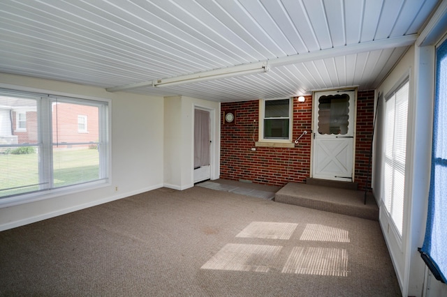 unfurnished sunroom featuring plenty of natural light