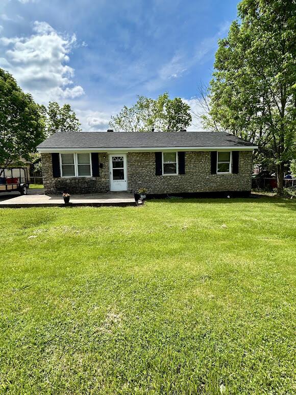 324 Spruce Dr, Frankfort, KY 40601 - ranch-style house featuring a front lawn, stone siding, and a patio