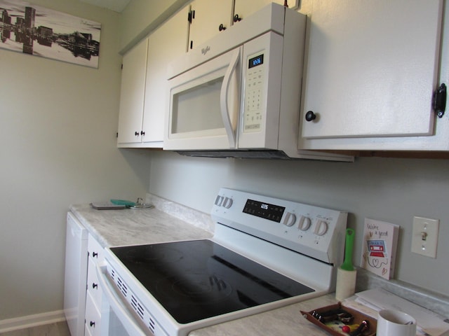 324 Spruce Dr, Frankfort, KY 40601 - kitchen with white appliances, light countertops, and white cabinets