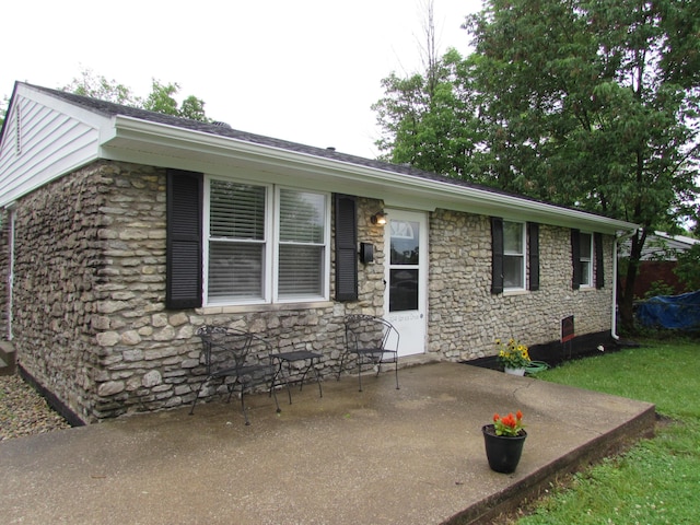 324 Spruce Dr, Frankfort, KY 40601 - ranch-style home featuring stone siding and a patio