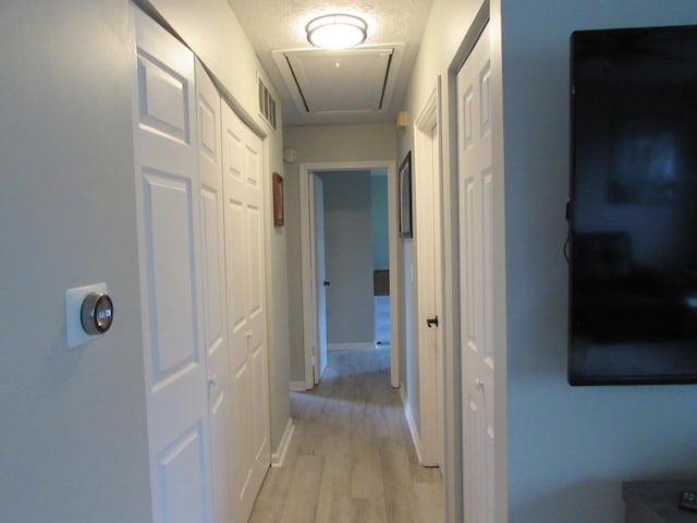 324 Spruce Dr, Frankfort, KY 40601 - hallway with attic access, light wood-style floors, and baseboards