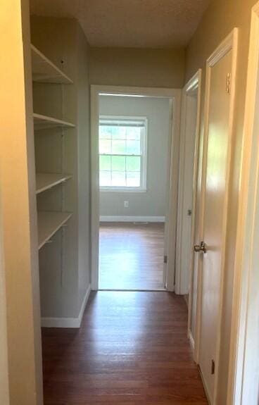 3440 Sutherland Dr, Lexington, KY 40517 - hallway with wood finished floors, baseboards, and built in shelves
