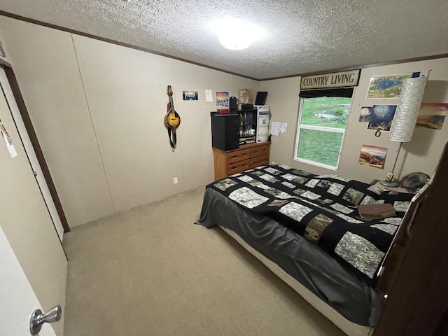 carpeted bedroom featuring a textured ceiling and crown molding