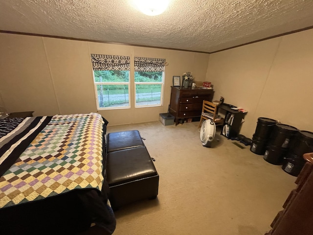 bedroom featuring a textured ceiling and carpet floors