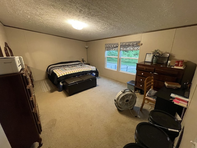 bedroom with carpet floors and a textured ceiling