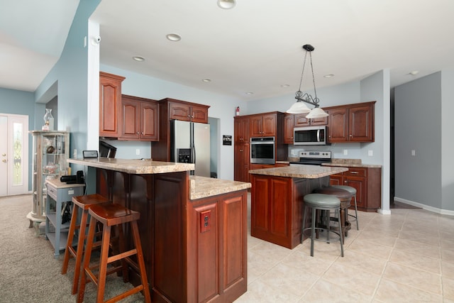 1335 Curtis Pike, Richmond, KY 40475 - kitchen with appliances with stainless steel finishes, a breakfast bar area, a peninsula, recessed lighting, and pendant lighting