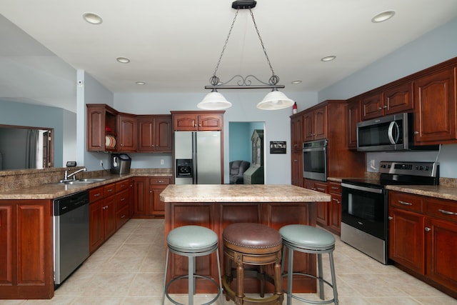 1335 Curtis Pike, Richmond, KY 40475 - kitchen with stainless steel appliances, a center island, a sink, a kitchen bar, and decorative light fixtures