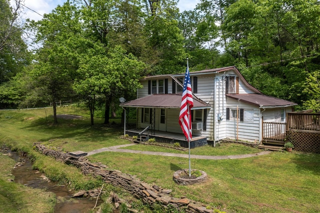 1335 Curtis Pike, Richmond, KY 40475 - view of front of house featuring a porch, a front lawn, cooling unit, and metal roof