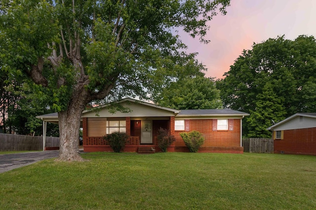 301 Vaught St, Somerset, KY 42501 - view of front facade with driveway, a carport, brick siding, and entry steps