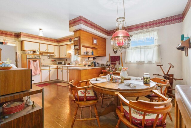 301 Vaught St, Somerset, KY 42501 - dining room with hardwood / wood-style floors and a chandelier