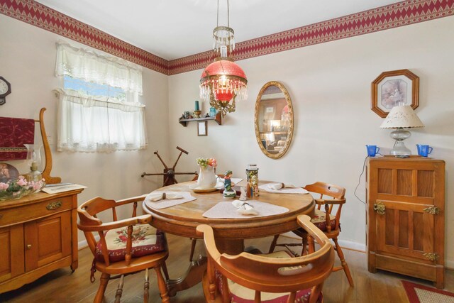 301 Vaught St, Somerset, KY 42501 - dining room with wood finished floors, baseboards, and a chandelier