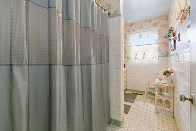 301 Vaught St, Somerset, KY 42501 - bathroom featuring wallpapered walls, tile walls, wainscoting, tile patterned floors, and curtained shower
