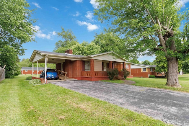 301 Vaught St, Somerset, KY 42501 - single story home with brick siding, a chimney, driveway, a front yard, and a carport