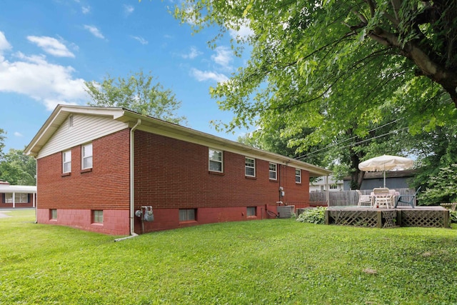 301 Vaught St, Somerset, KY 42501 - view of side of home with brick siding, a yard, a wooden deck, and central AC unit
