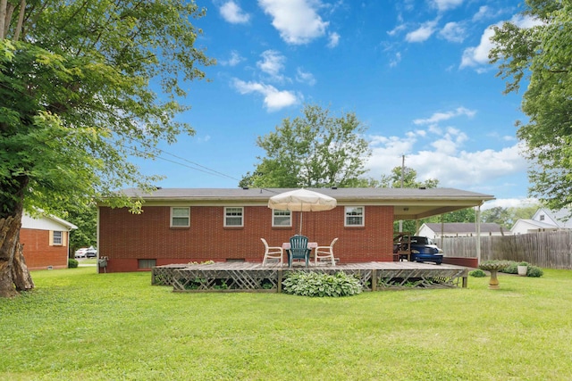 301 Vaught St, Somerset, KY 42501 - rear view of house with a deck, brick siding, and a carport