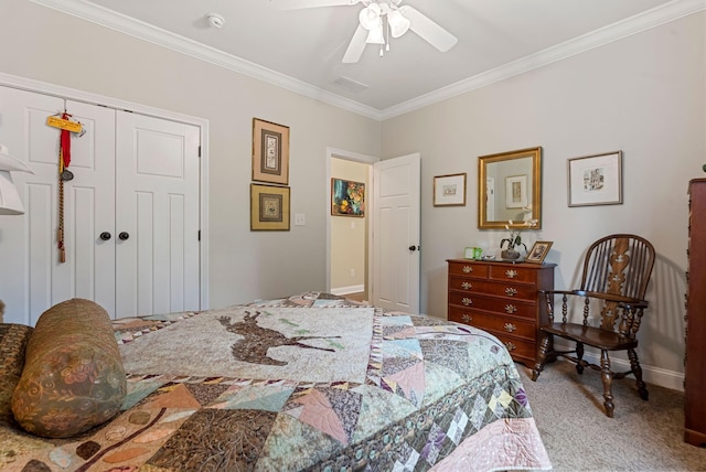 bedroom with carpet floors, ornamental molding, a closet, ceiling fan, and baseboards
