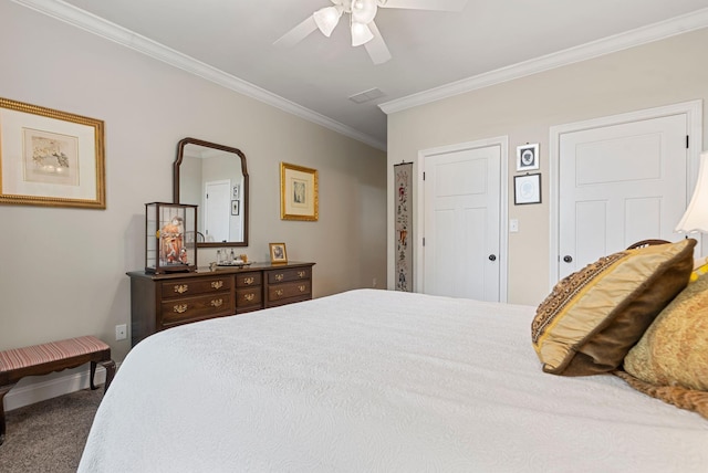 bedroom featuring carpet flooring, ornamental molding, and a ceiling fan
