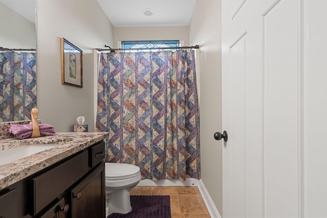 bathroom with toilet, vanity, and a shower with curtain