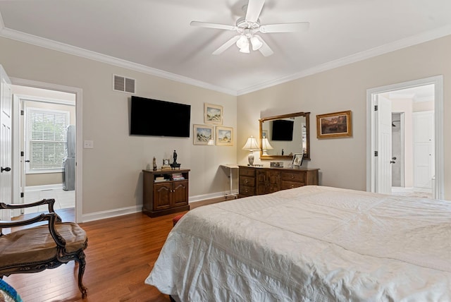 bedroom featuring crown molding, wood finished floors, baseboards, and ceiling fan
