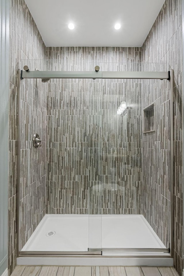 full bathroom featuring a stall shower and recessed lighting