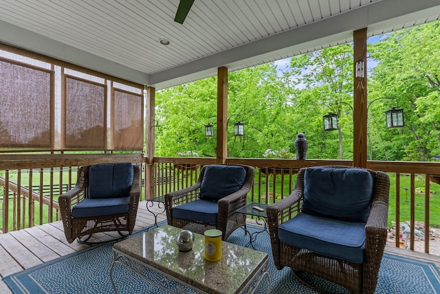 deck with ceiling fan and outdoor lounge area