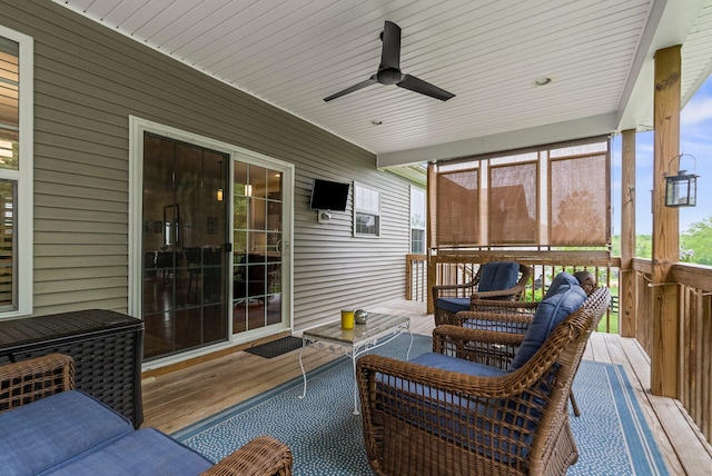 sunroom with a ceiling fan