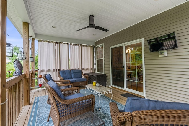 sunroom with ceiling fan and outdoor lounge area