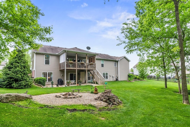 back of house with a fire pit, stairway, a deck, and a patio area