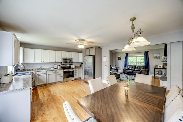 44 Gwinn Island Cir, Danville, KY 40422 - dining room featuring ceiling fan and light wood-style flooring