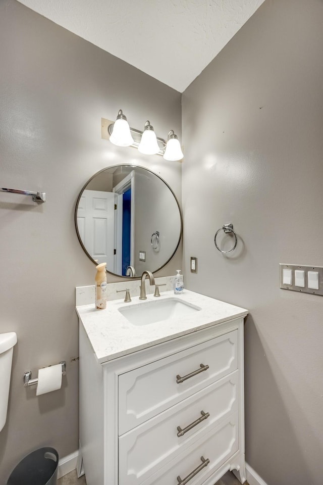 44 Gwinn Island Cir, Danville, KY 40422 - bathroom with toilet, vanity, and baseboards