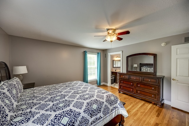 44 Gwinn Island Cir, Danville, KY 40422 - bedroom with light wood-style floors, baseboards, a ceiling fan, and ensuite bathroom
