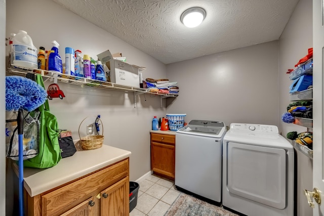 44 Gwinn Island Cir, Danville, KY 40422 - laundry area with washer and dryer, cabinet space, light tile patterned floors, a textured ceiling, and baseboards