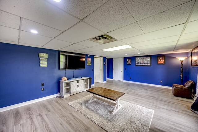 44 Gwinn Island Cir, Danville, KY 40422 - unfurnished living room featuring baseboards, wood finished floors, and a paneled ceiling