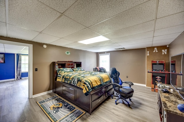 44 Gwinn Island Cir, Danville, KY 40422 - bedroom featuring a paneled ceiling, light wood-type flooring, baseboards, and multiple windows