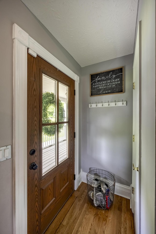 44 Gwinn Island Cir, Danville, KY 40422 - doorway with baseboards, wood finished floors, and a textured ceiling