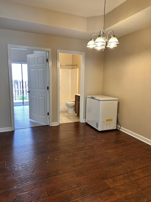 3804 Polo Club Blvd, Lexington, KY 40509 - empty room featuring baseboards, a chandelier, and wood finished floors